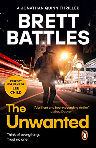 Book cover: man with gun walking at night in a city.