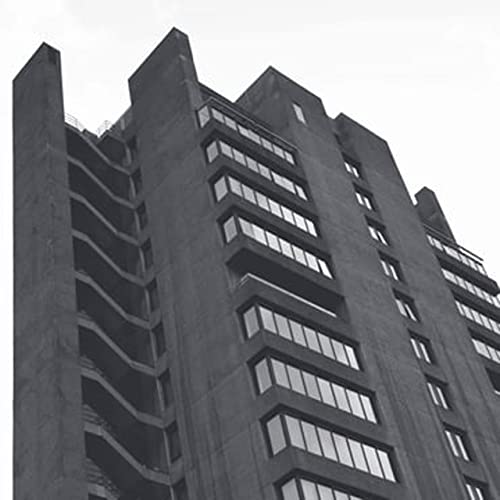 Black and white photo of a brutalist concrete apartment building.