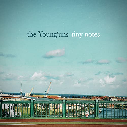 Album cover showing a green bridge railing overlooking a harbor with cranes and sky.