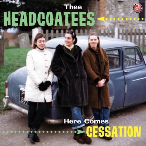 Three women stand by a blue vintage car on an album cover.