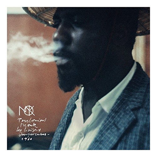 Thelonious Monk wearing a straw hat and smoking, with album title text overlaid.