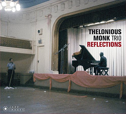 Thelonious Monk at a piano on stage, with a janitor nearby.