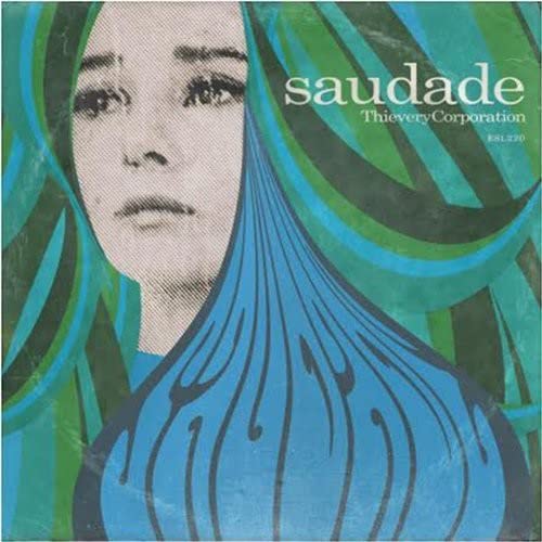 CD cover for Thievery Corporationās āSaudadeā featuring a womanās face and blue waves.