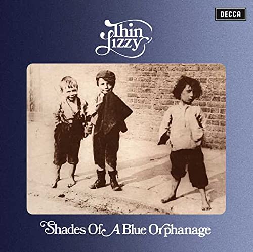 Thin Lizzy album cover featuring a vintage sepia photograph of three children standing outside.
