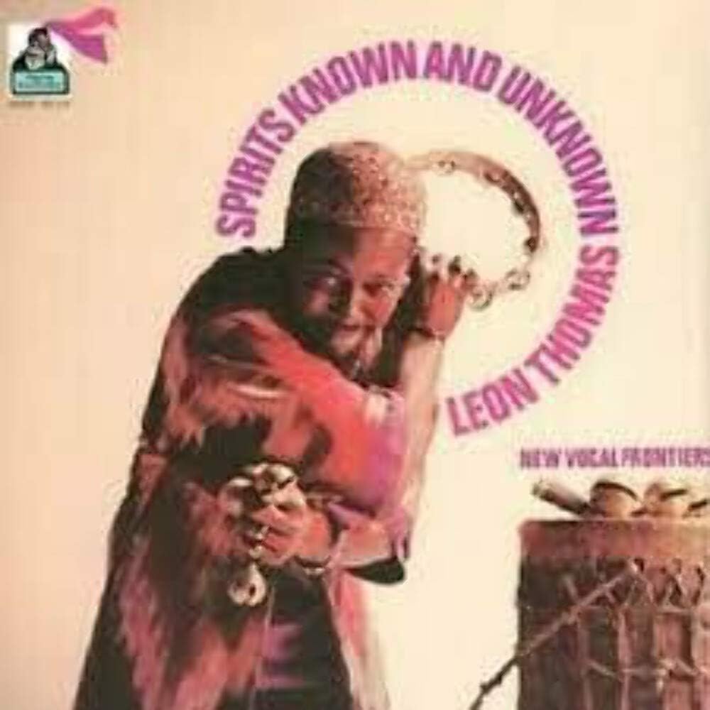 Vinyl album cover featuring a man with a musical instrument and drums.