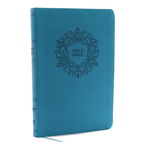Blue imitation leather NKJV Bible with a decorative floral emblem and Holy Bible text.