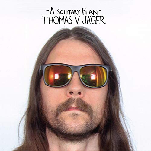 Portrait of a man with long hair and sunglasses, album cover.