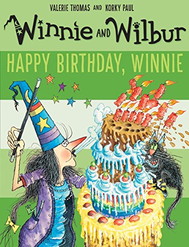 Winnie the witch and her cat Wilbur stand beside a large, messy birthday cake.