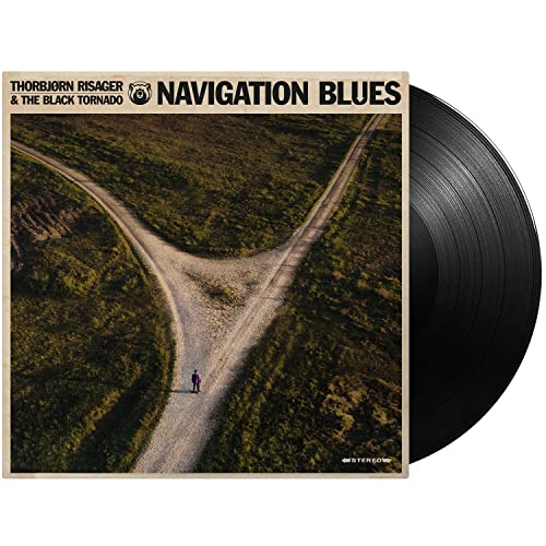 Vinyl record cover with a lone figure at a three-way road split.