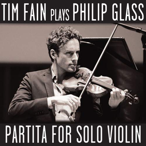 Violinist Tim Fain playing a violin on the album cover for Philip Glass’ Partita.