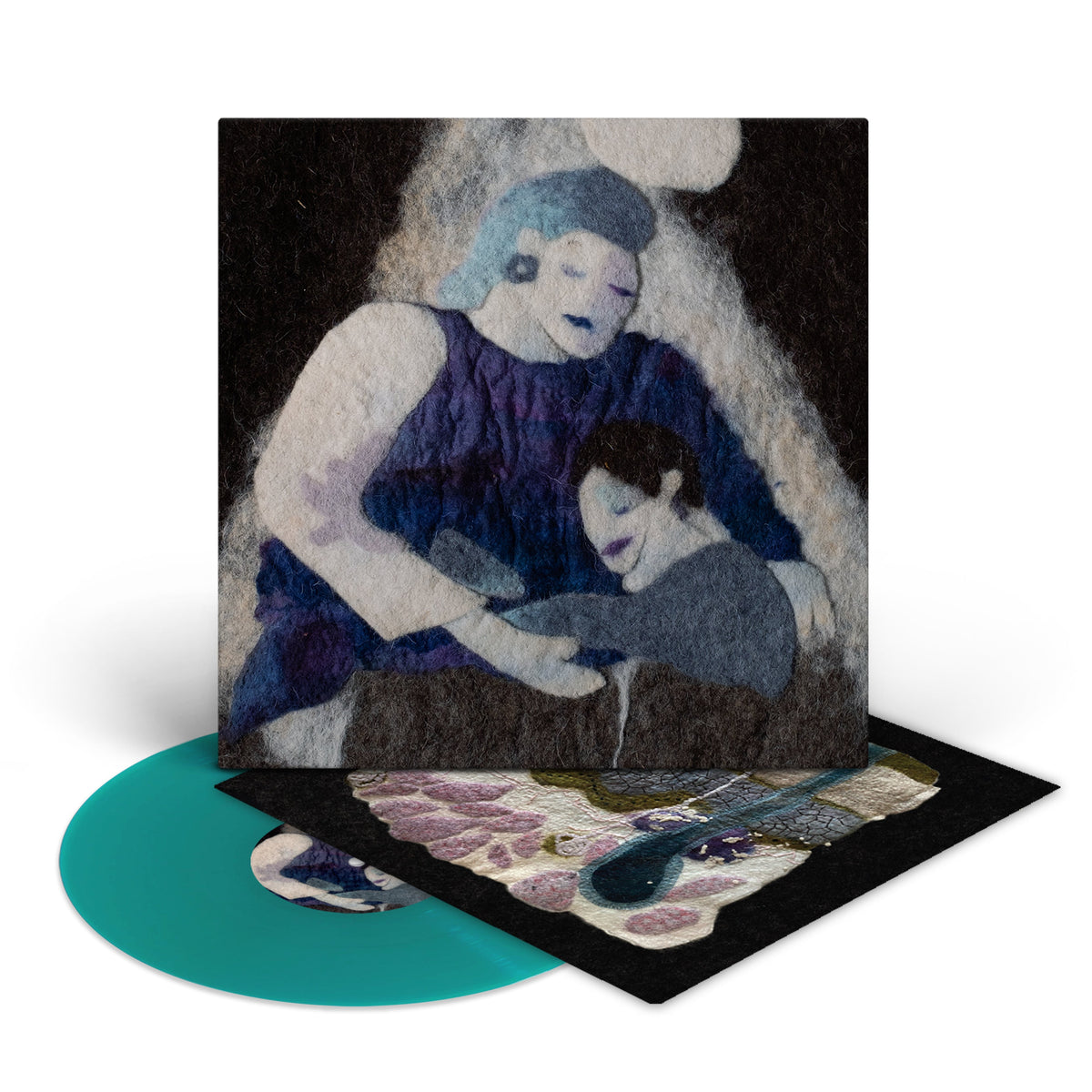 Vinyl record of Tindersticks’ “Soft Tissue” with abstract, textured cover art.