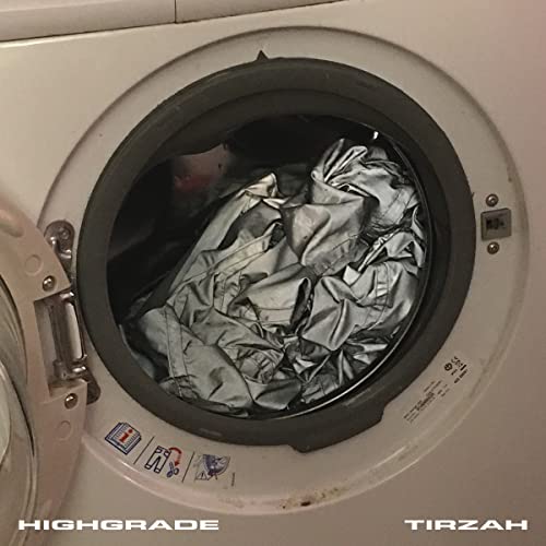 Vinyl record cover featuring a crumpled silver garment inside a washing machine.