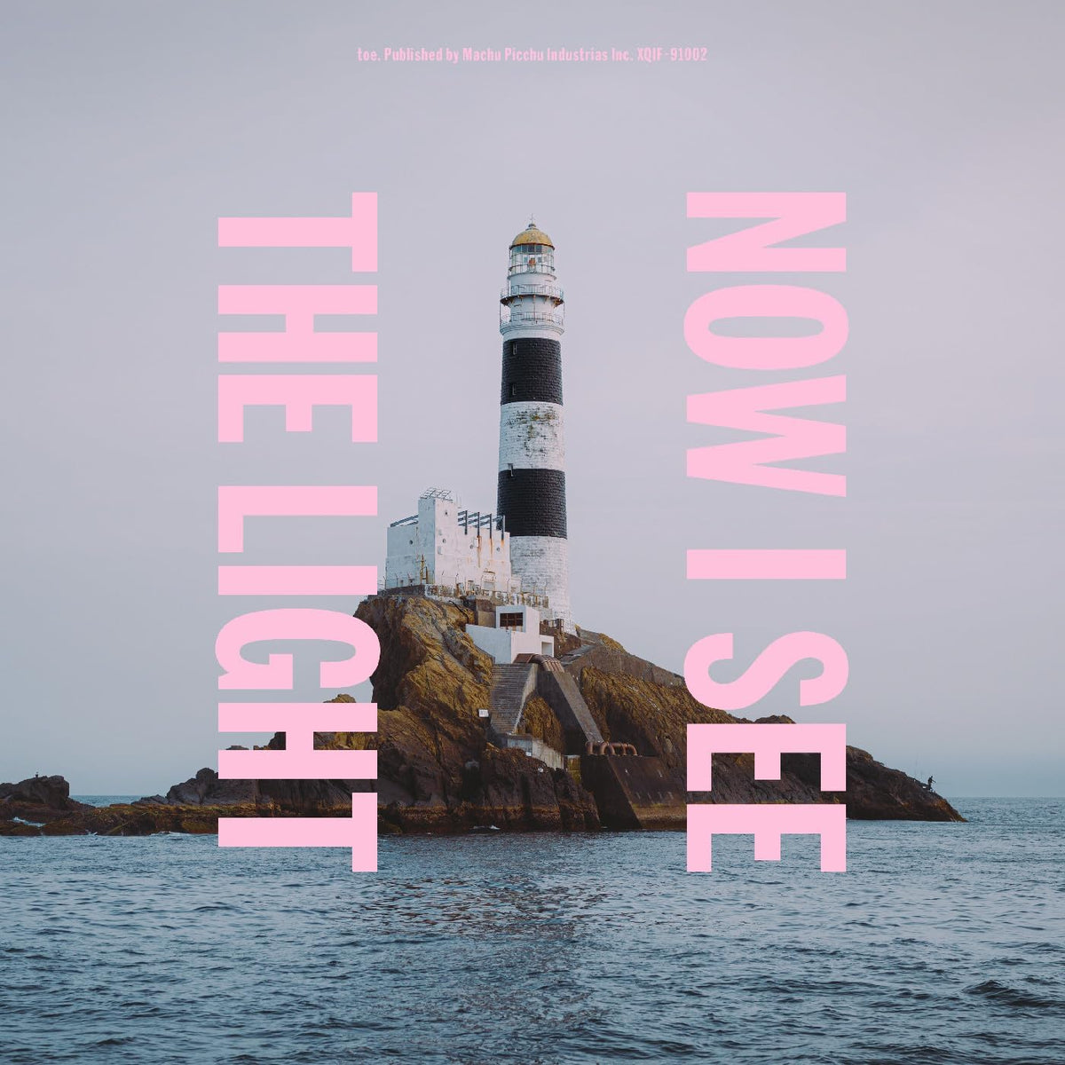 Vinyl album cover featuring a lighthouse on a rocky island at sea.
