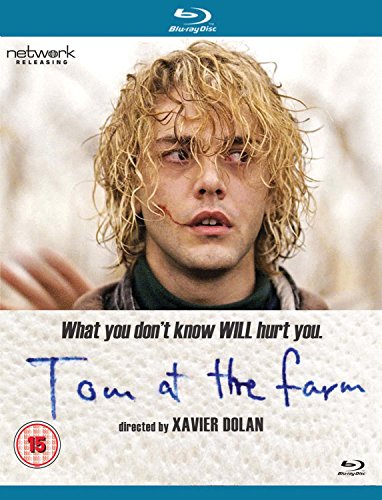 Blu-ray cover for "Tom at the Farm" featuring a young man with messy hair.