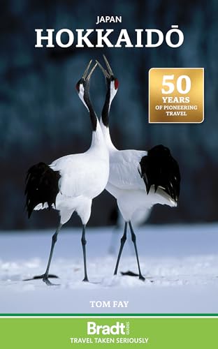 Book cover featuring two red-crowned cranes standing in snow against a dark background.