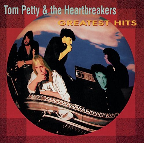 Album cover showing Tom Petty and the Heartbreakers in a studio against red background.