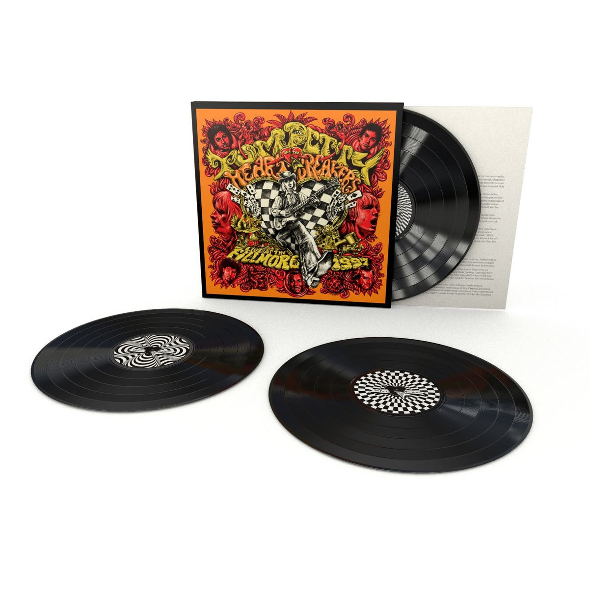 "Three vinyl records with a colorful album cover and white background."