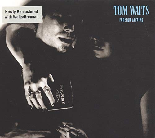 Black and white album cover featuring Tom Waits holding a passport with a woman.