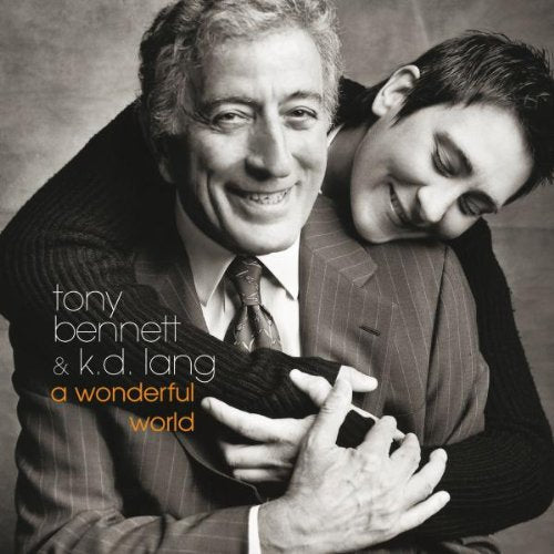 Black and white portrait of Tony Bennett and k.d. lang embracing affectionately.