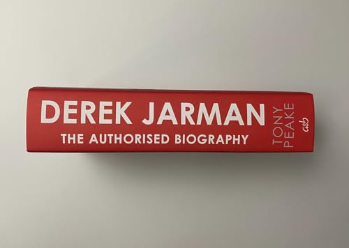 The red spine of the book Derek Jarman: The Authorised Biography by Tony Peake.