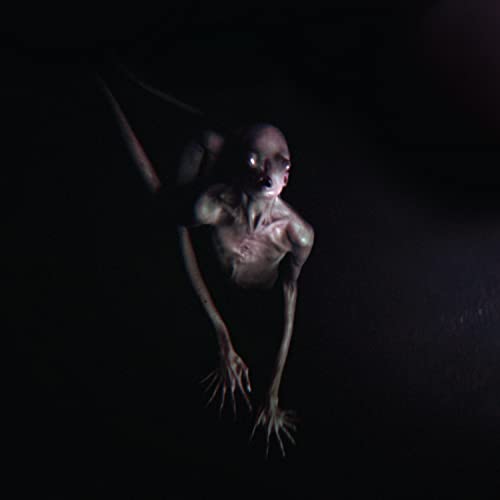 Dark, unsettling image of a gaunt, pale figure with outstretched limbs.