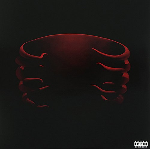Dark red, abstract swirling shape against a black background.