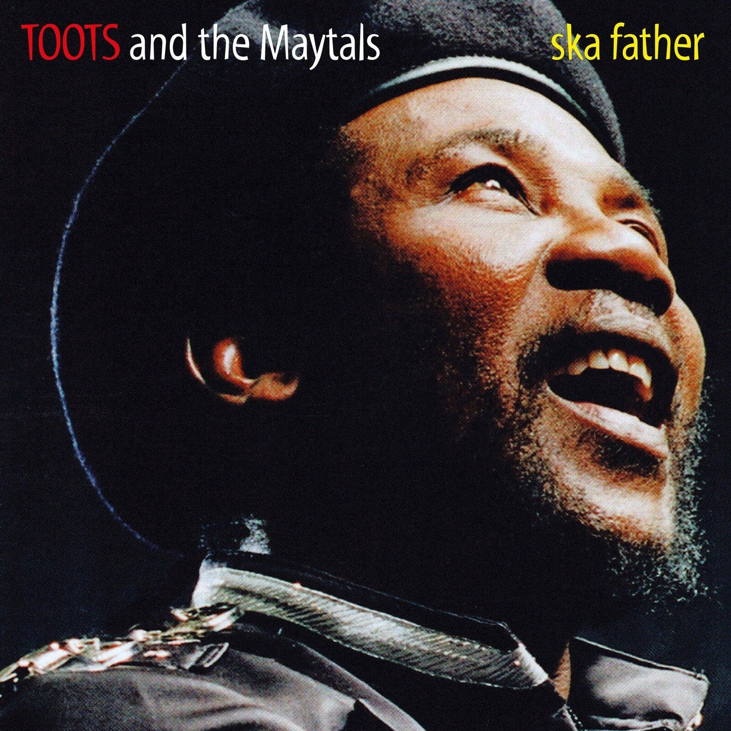 Close-up portrait of Toots Hibbert wearing a black beret, album cover.