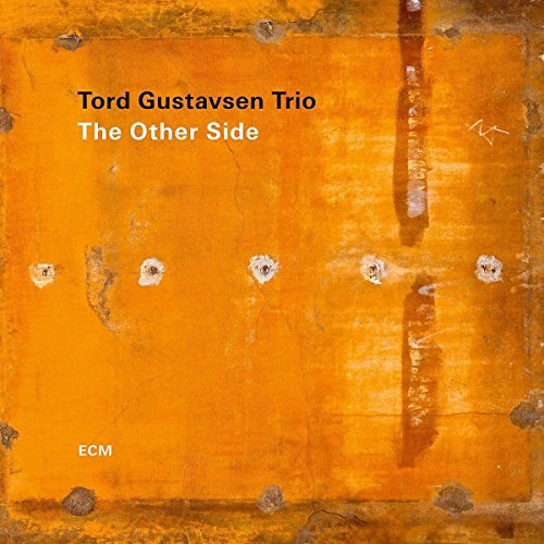 "Album cover with orange metal background, rusty texture, and 'Tord Gustavsen Trio' text."