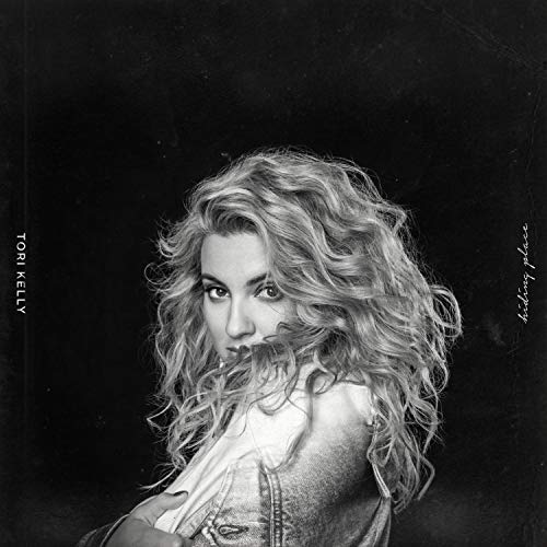 "Tori Kelly's 'Hiding Place' CD cover featuring a black-and-white portrait of the artist."