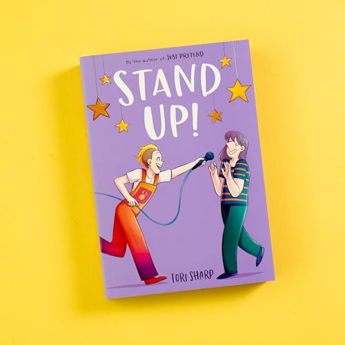 Cover of "Stand Up!" graphic novel featuring two characters and a microphone.PC.