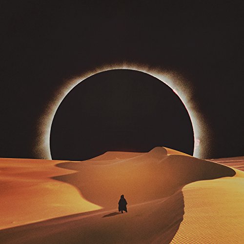 Desert landscape with a lone figure beneath a dark, circular sky.