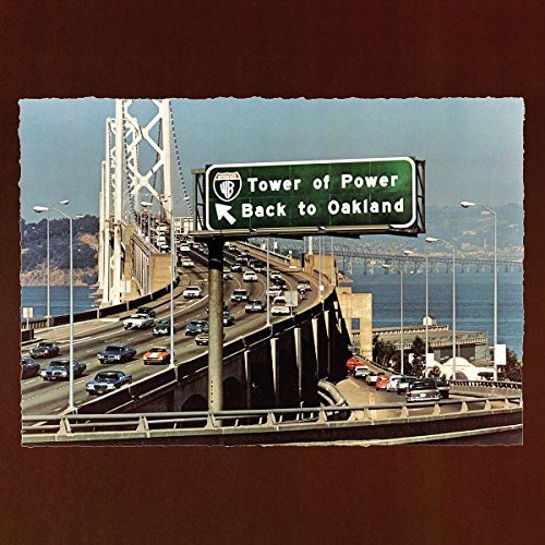 "Tower of Power vinyl album cover featuring a highway sign pointing to Oakland."