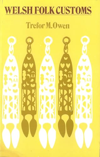 Yellow book cover with decorative Welsh love spoons design.