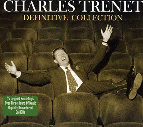 CD cover: Charles Trenet in a suit, arms raised, seated in theatre seats.