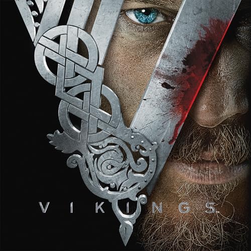 Close-up of a bearded man with a Viking symbol and blood splatter.