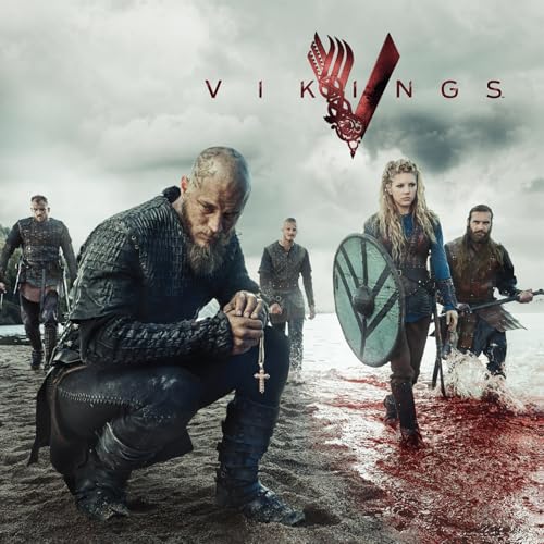 Vikings cast members on a beach, with stormy skies and red water.