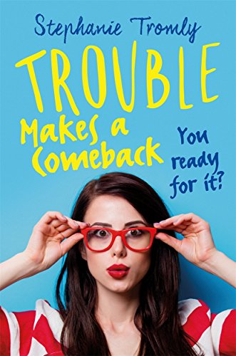 Book cover: woman in red glasses smiles, title “Trouble Makes a Comeback.”