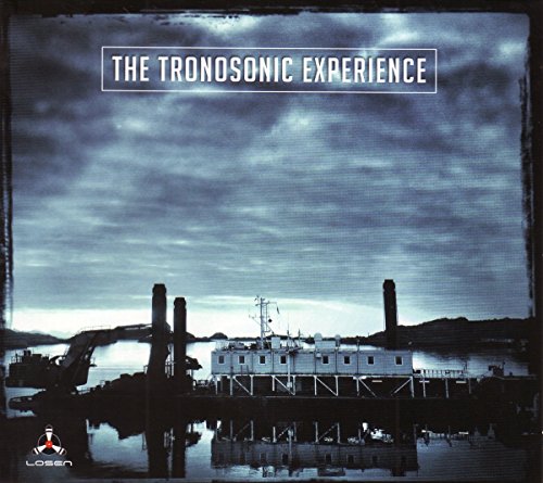 Album cover: dark seascape with industrial structures and stormy sky.