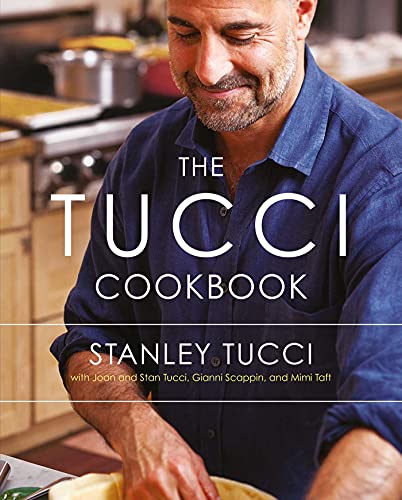 Stanley Tucci smiling while preparing food in a kitchen on a cookbook cover.
