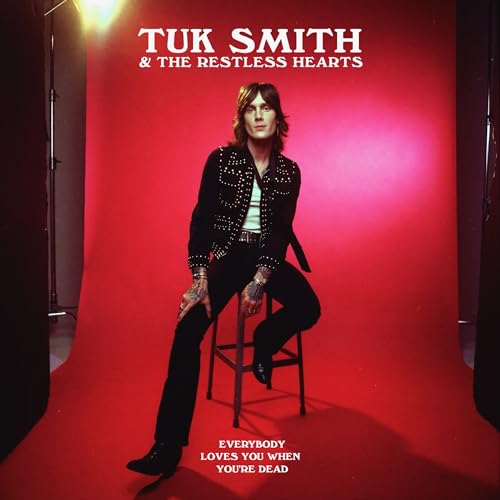 Album cover for Tuk Smith & The Restless Heart, man on stool.