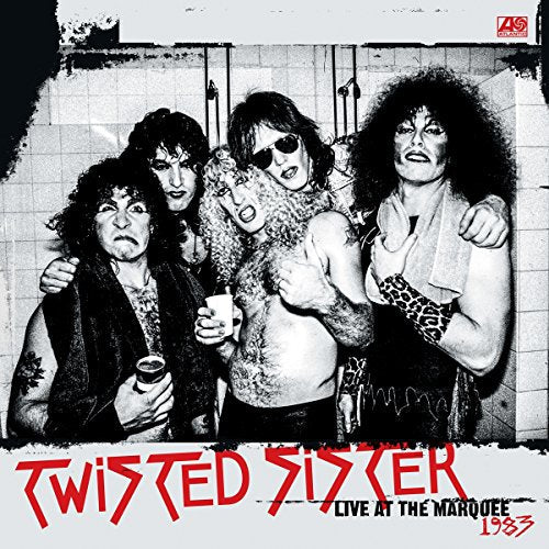Twisted Sister band portrait in a gritty, tiled room, 1983 album cover.
