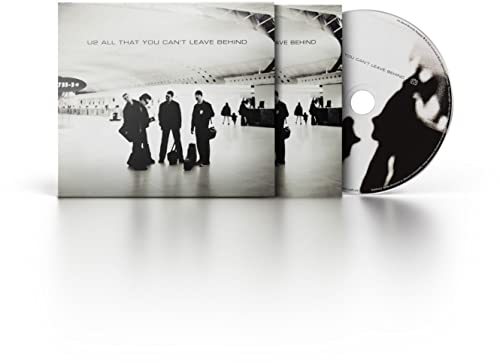 U2 album cover: band at airport, open CD case visible.