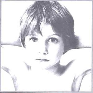 Black and white portrait of a young man, U2’s “Boy” album cover.