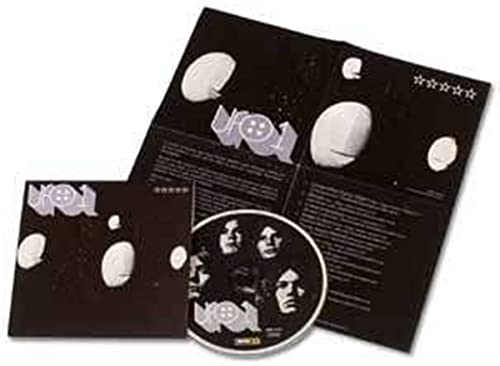 CD case and disc for "Ufo 1" by the band UFO, black background.