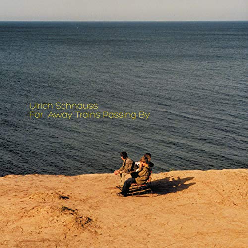 Album cover: ocean view with two figures sitting on a bench.