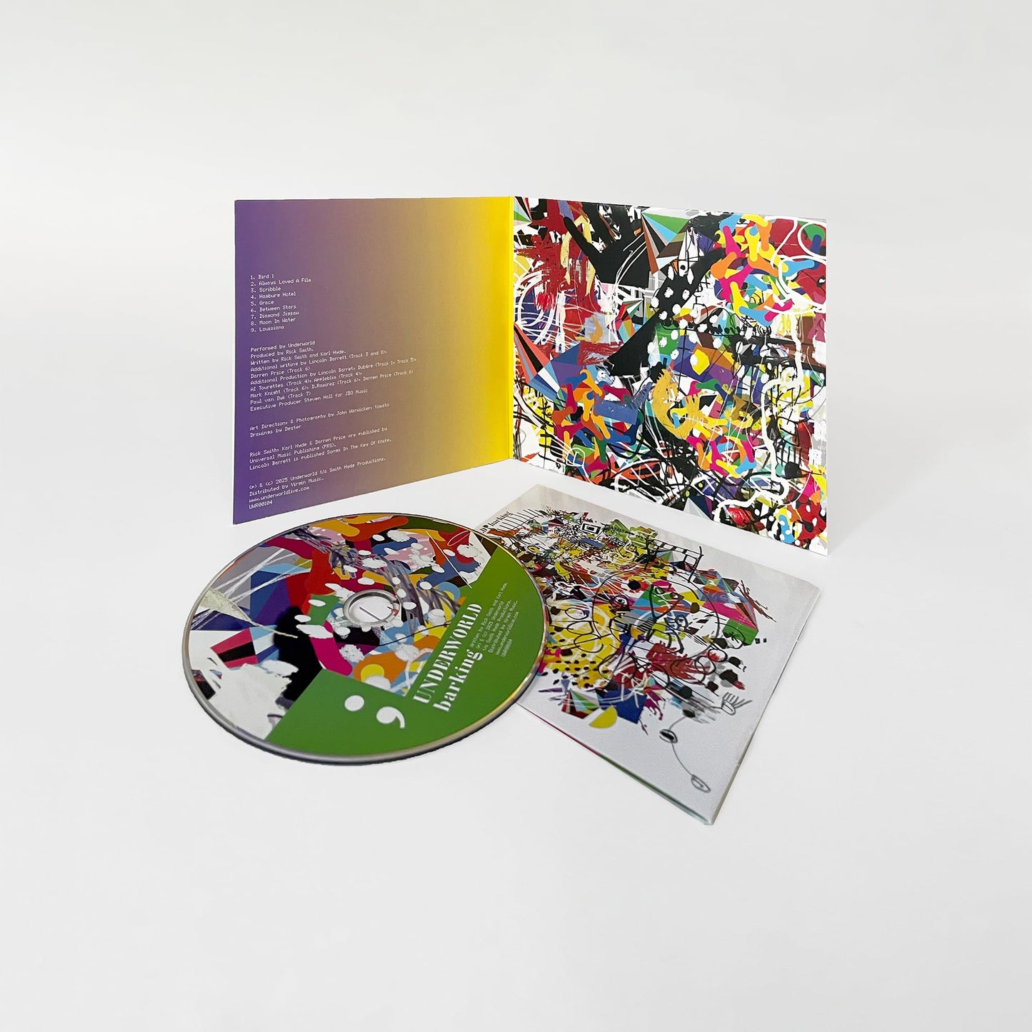 CD case open, showing colorful abstract art and the "Barking" album title.