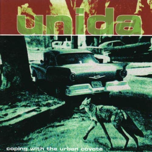 CD cover: Unida band name, vintage car, and a coyote in grass.