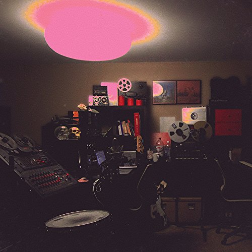 Vinyl record cover with a pink cloud over a cluttered music studio.