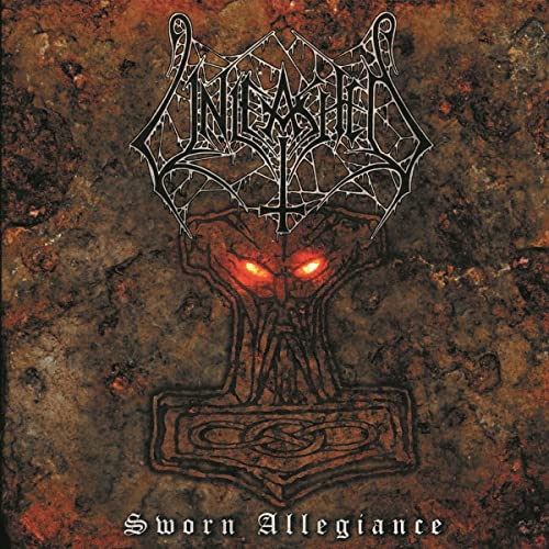 CD cover: dark, textured background with demonic face and band logo.