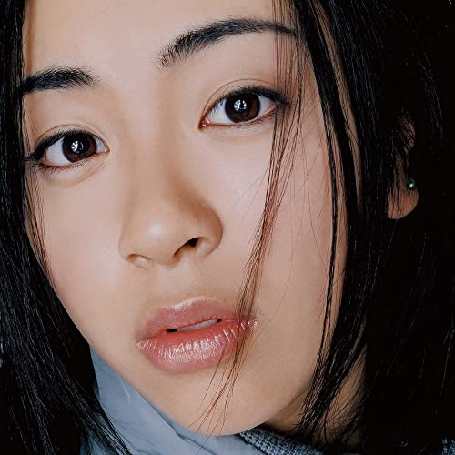 Close-up portrait of Utada Hikaru with dark hair and brown eyes.